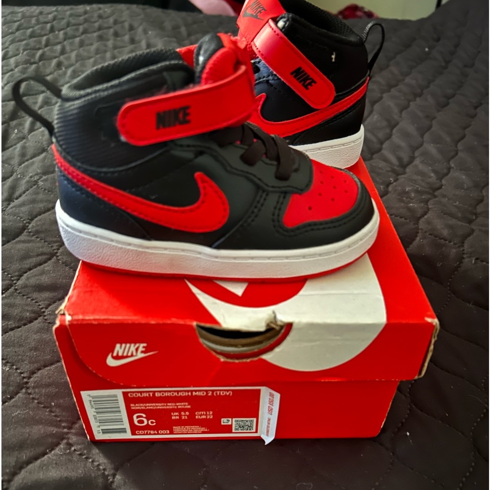 Brand new, never been worn Toddler Nike shoes. Red and black